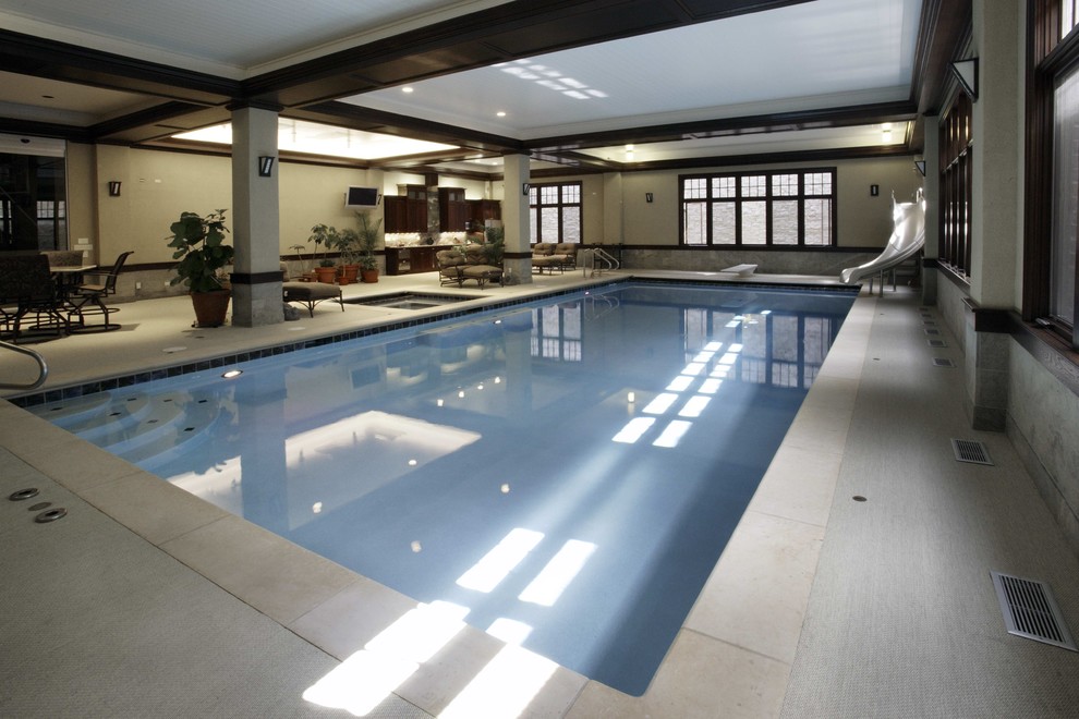 Inspiration for a mid-sized contemporary indoor rectangular pool in Chicago with a hot tub.