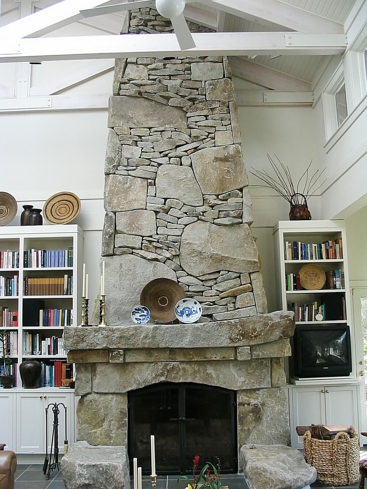 Inspiration for a mid-sized traditional formal open concept living room in Seattle with white walls, slate floors, a standard fireplace, a stone fireplace surround and no tv.