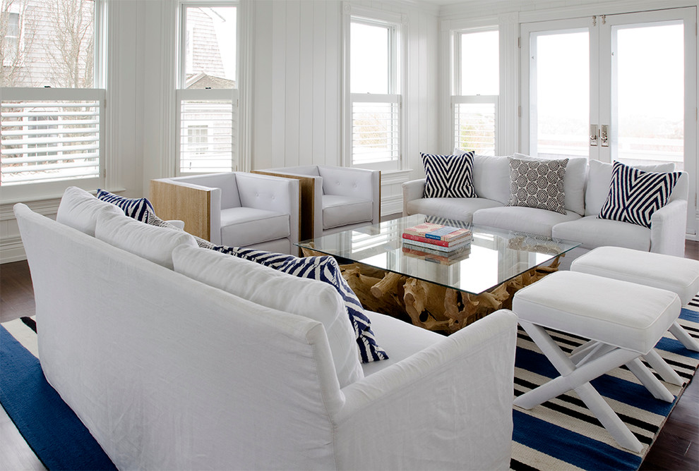 Photo of a beach style living room in New York with white walls.