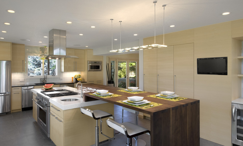 Design ideas for a modern kitchen in Denver with stainless steel appliances and wood benchtops.
