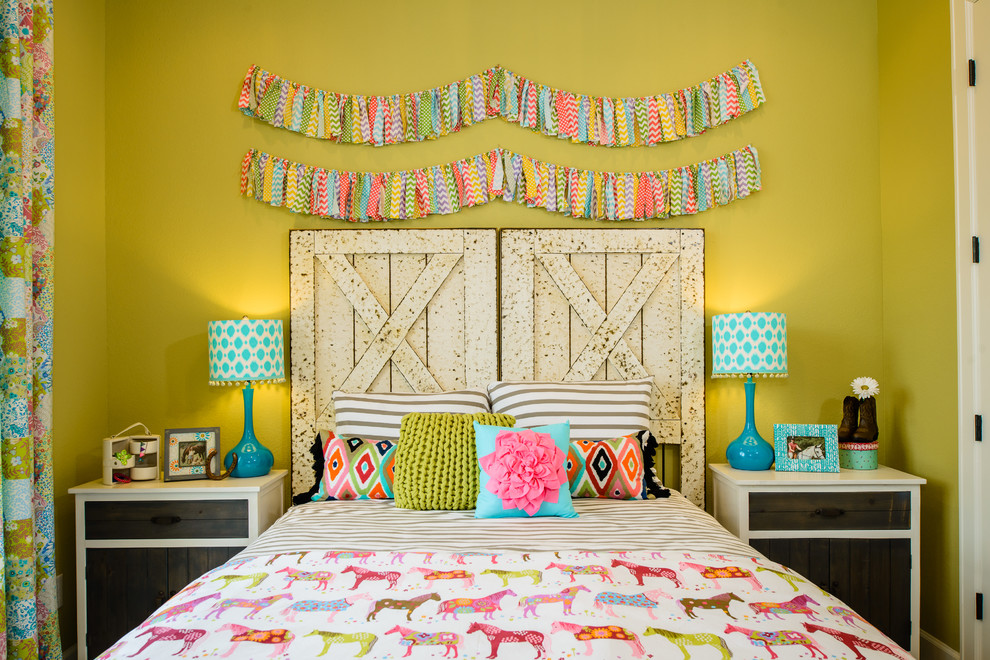 This is an example of a contemporary kids' bedroom for girls in Austin with green walls.