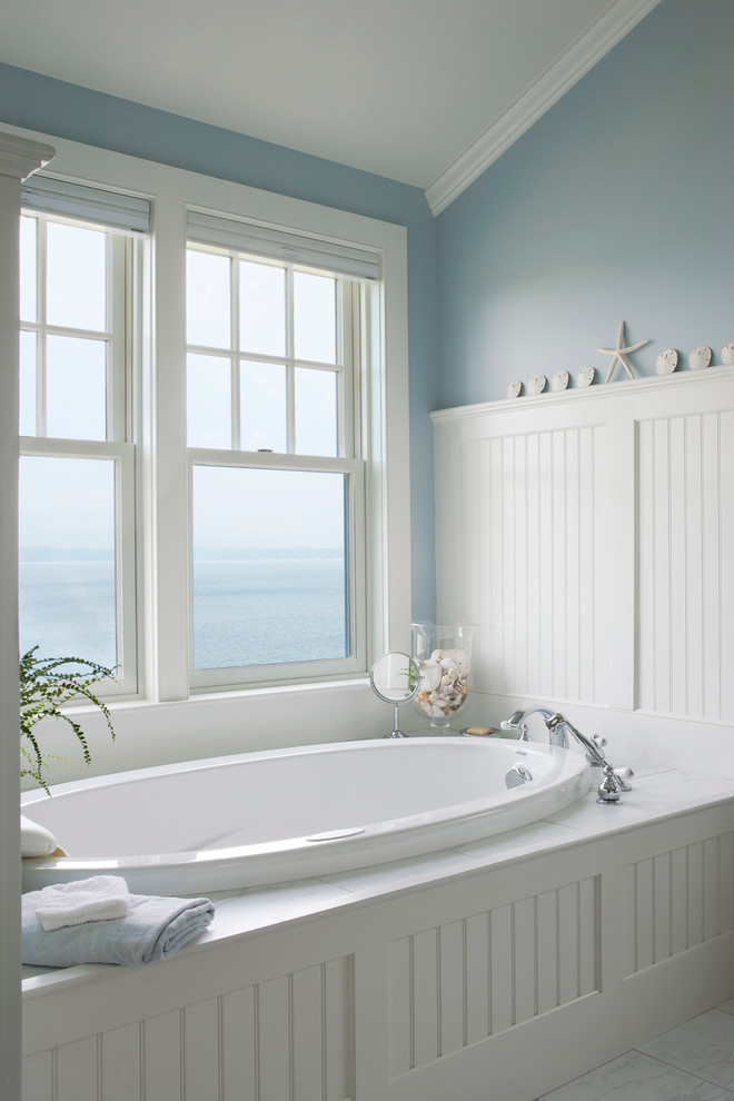 Design ideas for a beach style bathroom with an alcove tub.