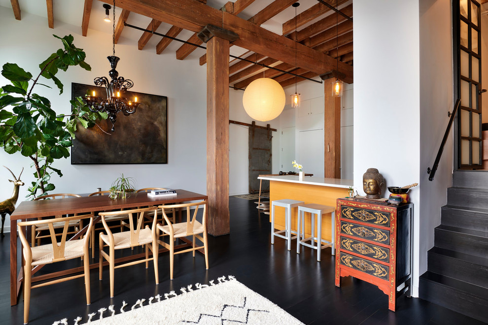 Dining room - industrial dark wood floor and black floor dining room idea in Other with white walls
