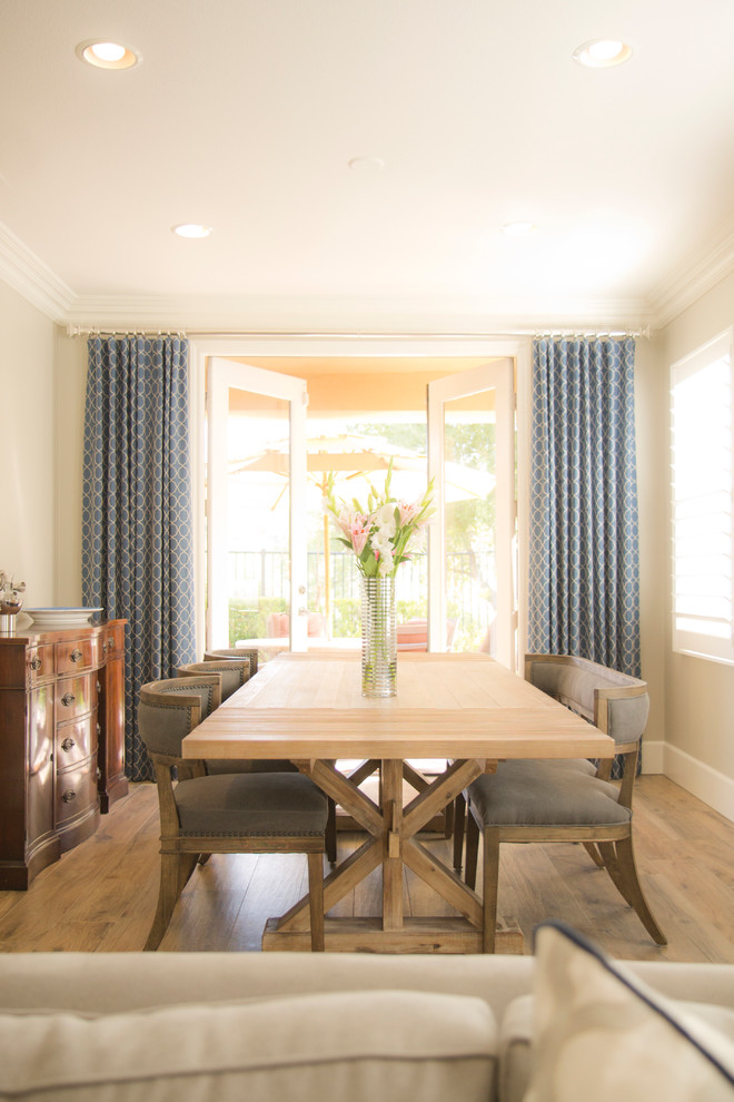 Large transitional open plan dining in San Diego with beige walls, medium hardwood floors and no fireplace.