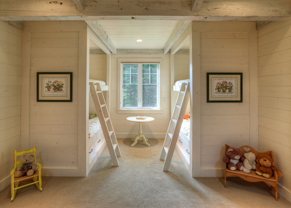 Photo of a traditional kids' room for girls in Seattle with beige walls and carpet.