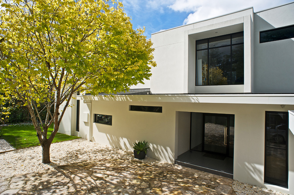 Large contemporary two-storey concrete white exterior in Melbourne.