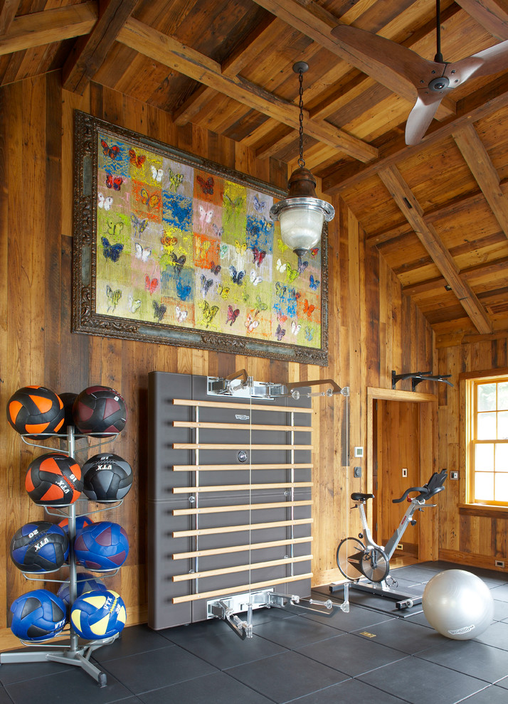 Inspiration for a country home gym in New York with brown walls and grey floor.