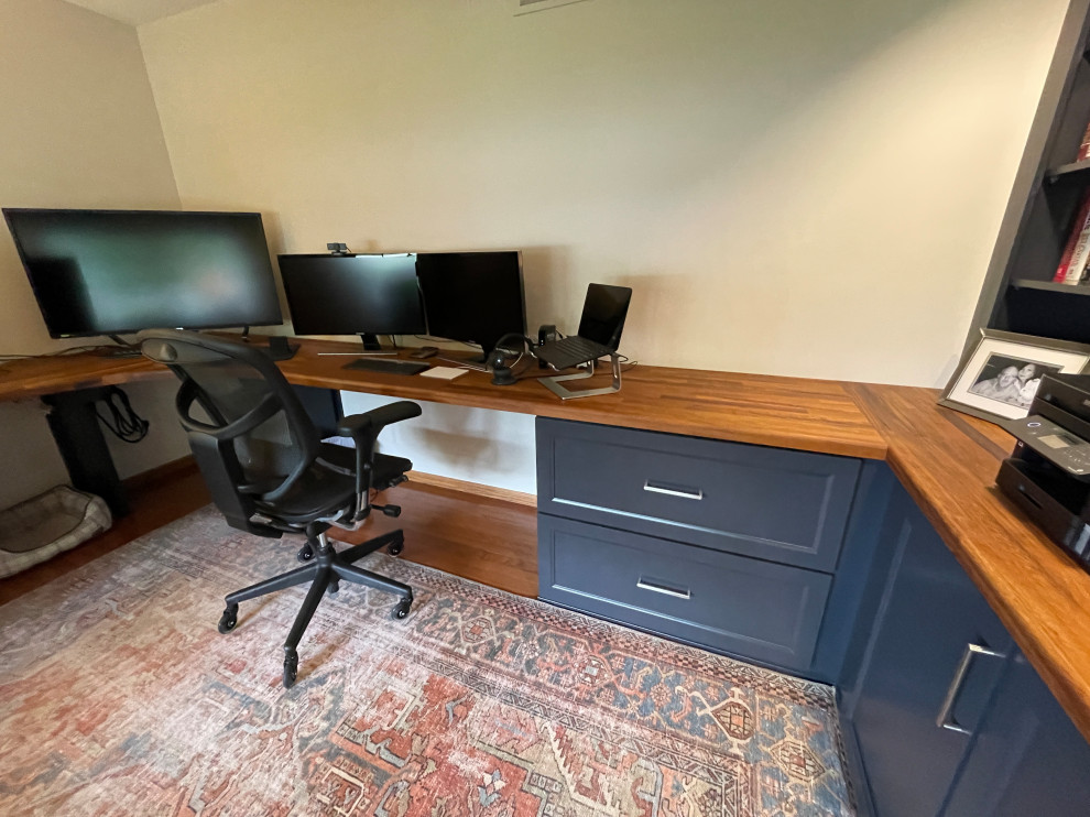 This is an example of a medium sized classic home office in Other with a built-in desk.