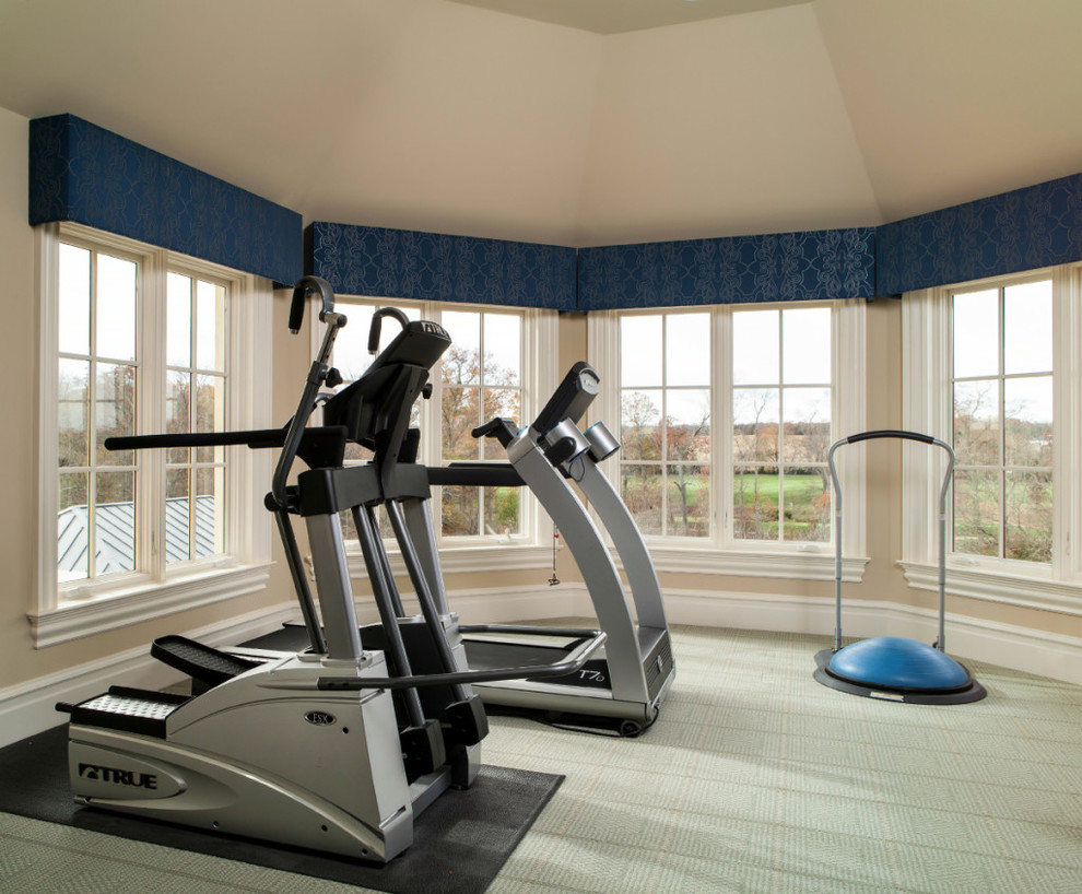 Inspiration for a traditional home gym in Charlotte with beige walls, carpet and green floor.