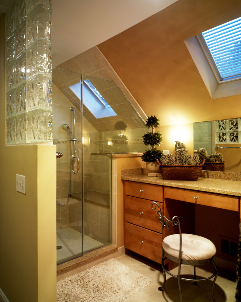 Inspiration for a contemporary bathroom in DC Metro with solid surface benchtops.
