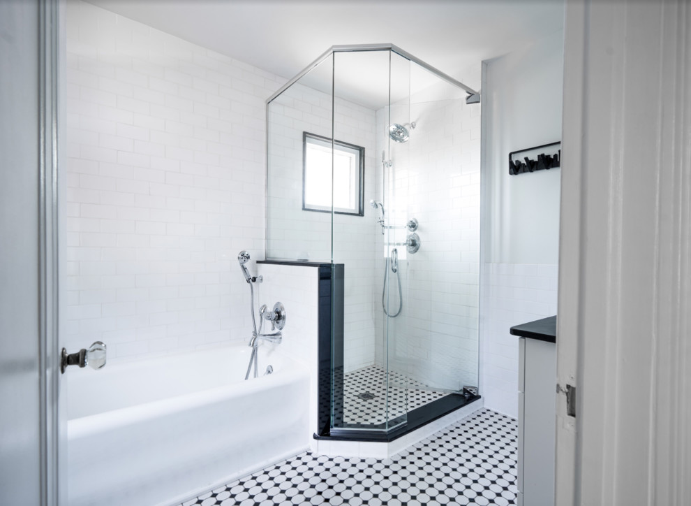 Design ideas for a mid-sized traditional master bathroom in Other with shaker cabinets, white cabinets, an alcove tub, a corner shower, a two-piece toilet, white tile, ceramic tile, green walls, mosaic tile floors, an undermount sink, engineered quartz benchtops, multi-coloured floor, a hinged shower door and black benchtops.