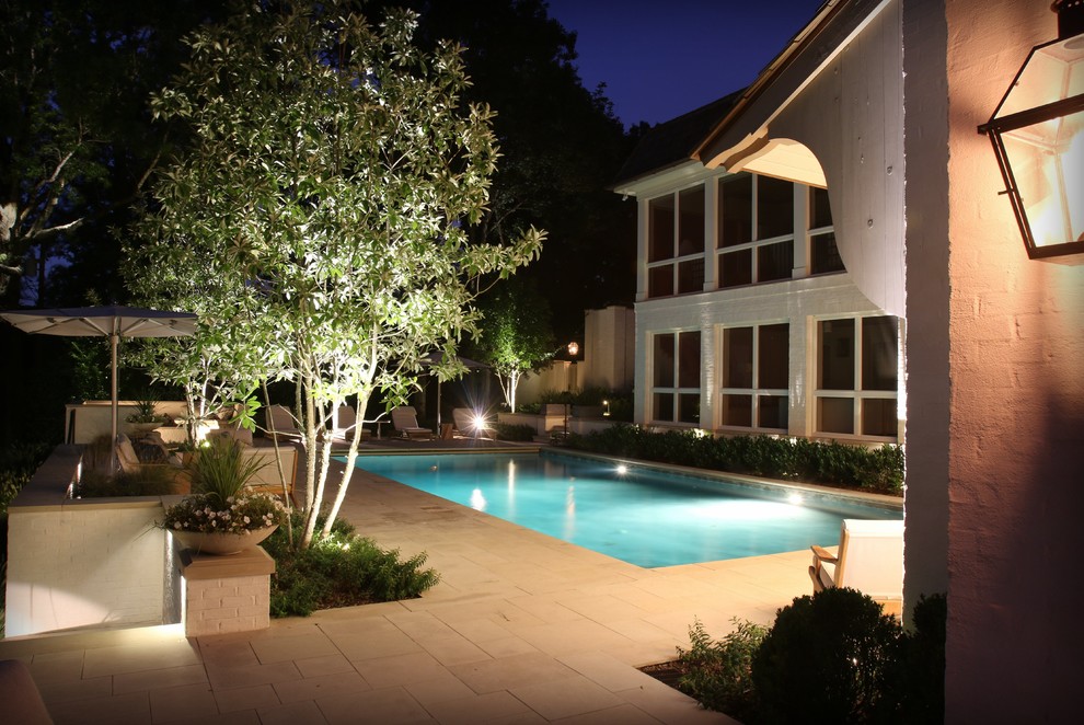Inspiration for a mid-sized transitional backyard stone and rectangular pool remodel in Nashville