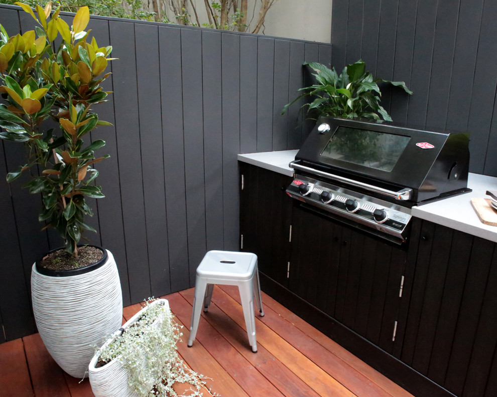Inspiration for a small contemporary courtyard patio in Sydney with an outdoor kitchen, no cover and decking.