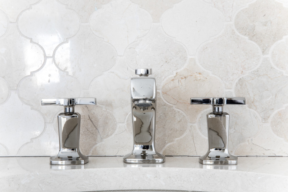 Transitional master beige tile and mosaic tile marble floor and gray floor home design photo in Boston with recessed-panel cabinets, white cabinets, a one-piece toilet, white walls, an undermount sink, quartz countertops, a hinged shower door and beige countertops