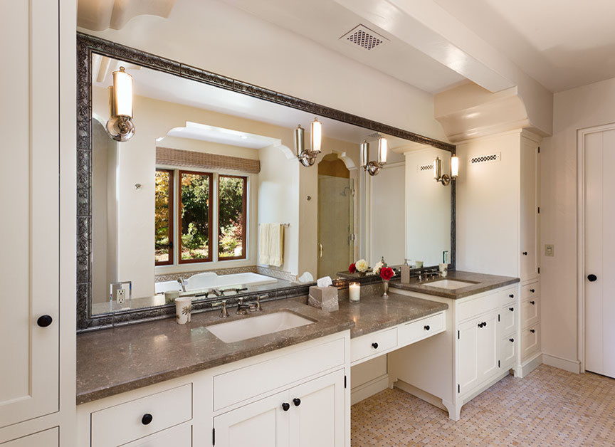 Photo of a mid-sized mediterranean master bathroom in Santa Barbara with an undermount sink, shaker cabinets, white cabinets, marble benchtops, an alcove shower, white walls and porcelain floors.