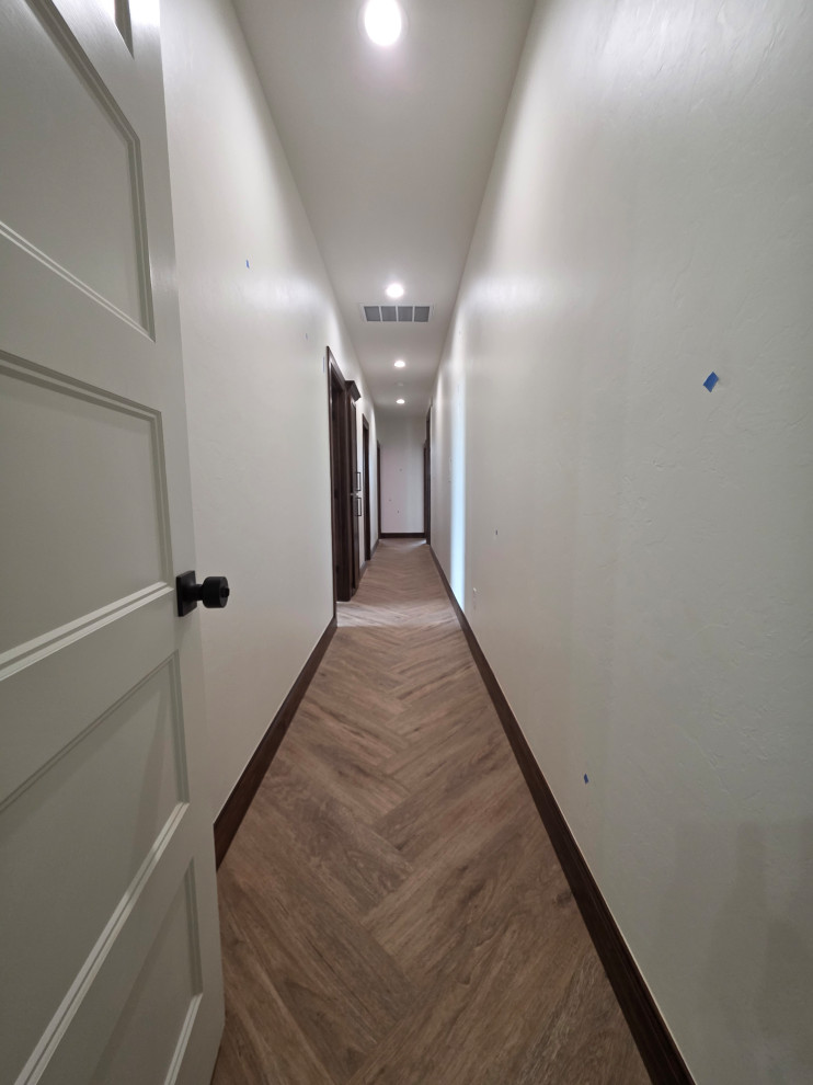 Hallway with herringbone patterned floor