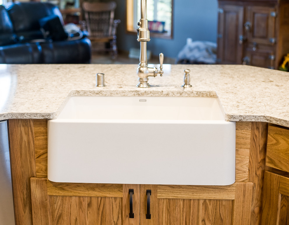 Example of a large mountain style u-shaped medium tone wood floor open concept kitchen design with a farmhouse sink, recessed-panel cabinets, purple cabinets, beige backsplash, stainless steel appliances, an island and granite countertops