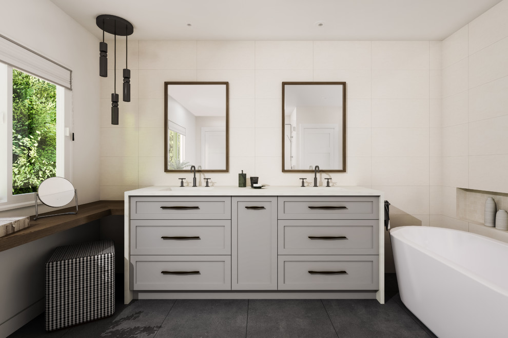 Inspiration for a mid-sized modern master bathroom with shaker cabinets, grey cabinets, a freestanding tub, an alcove shower, a one-piece toilet, beige tile, beige walls, an undermount sink, engineered quartz benchtops, grey floor, a hinged shower door, white benchtops, porcelain tile and slate floors.