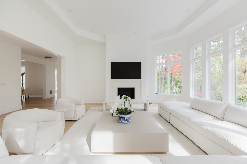 Spacious Modern Living Room with White Furniture and Large Windows
