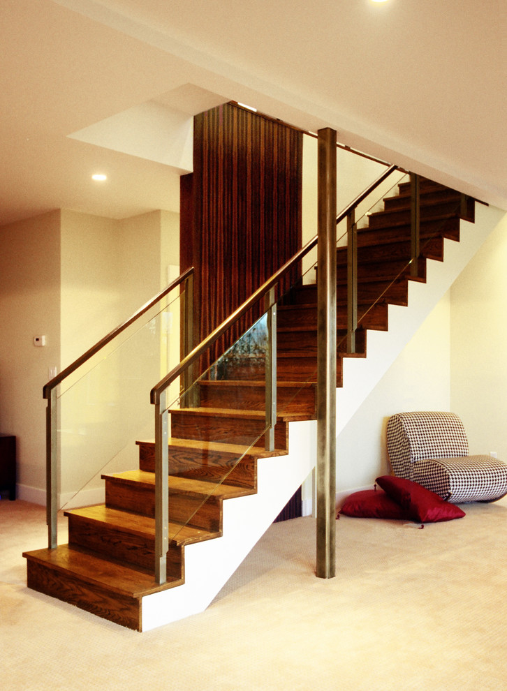 Design ideas for a mid-sized contemporary wood floating staircase in San Francisco with wood risers.