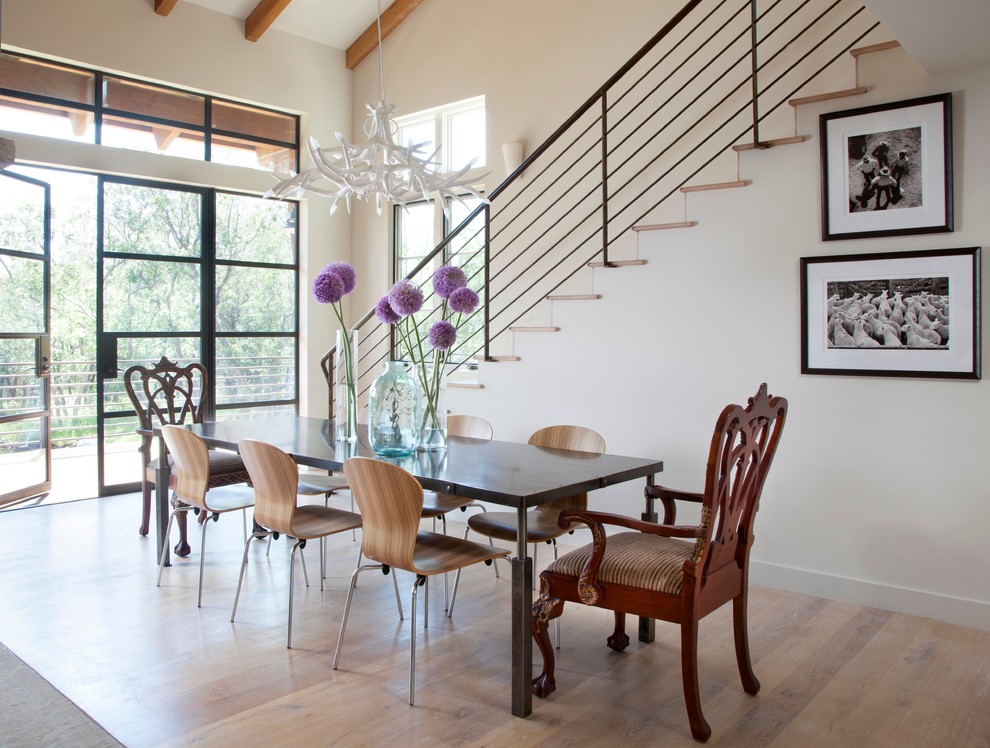 Country dining room in Denver with white walls and medium hardwood floors.