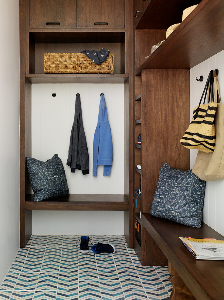 This is an example of a transitional mudroom in San Francisco with white walls, ceramic floors and blue floor.