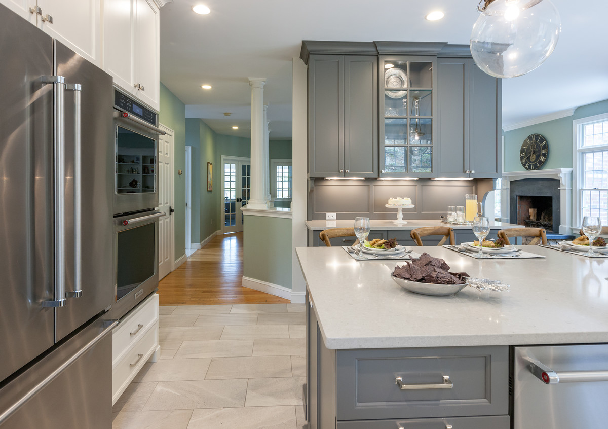 Inspiration for a transitional kitchen remodel in Boston with an undermount sink, gray cabinets, quartzite countertops and stainless steel appliances