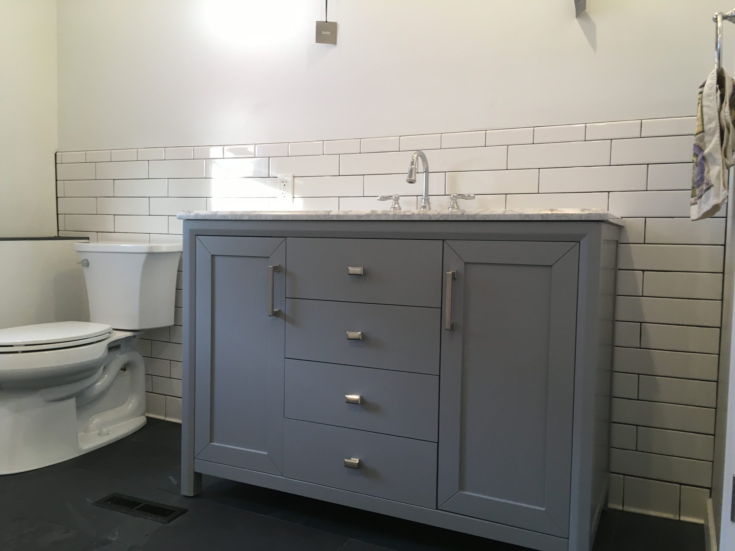 Subway tile shower and Stone floor