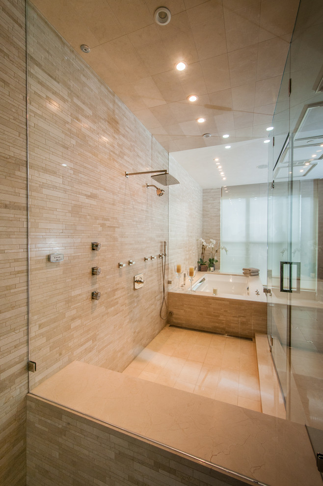 This is an example of a contemporary bathroom in Dallas with an undermount sink, a hot tub, a wall-mount toilet, furniture-like cabinets, medium wood cabinets, beige tile, stone tile and with a sauna.