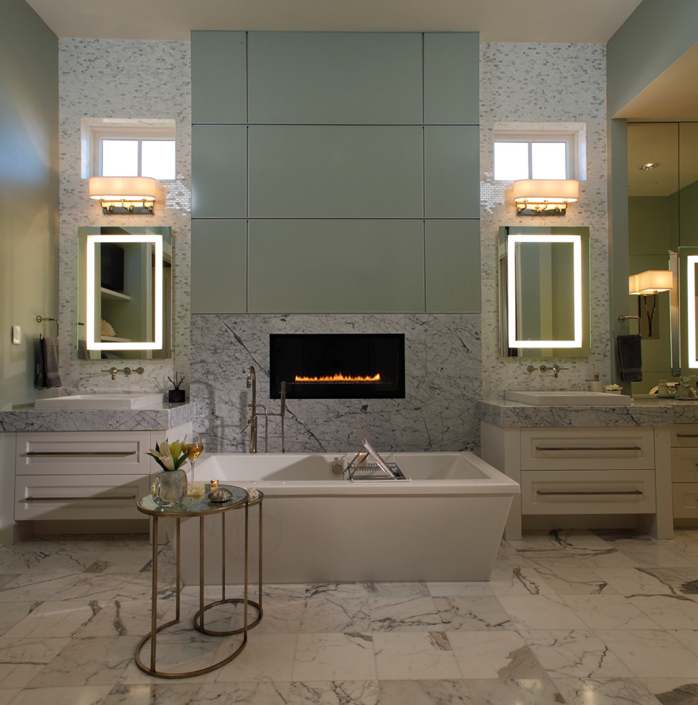 Design ideas for a contemporary bathroom in Miami with white cabinets, a freestanding tub and white tile.