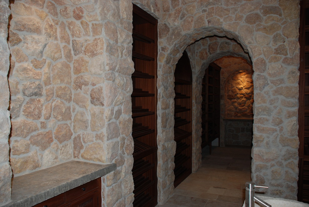 This is an example of a mediterranean wine cellar in Orange County.
