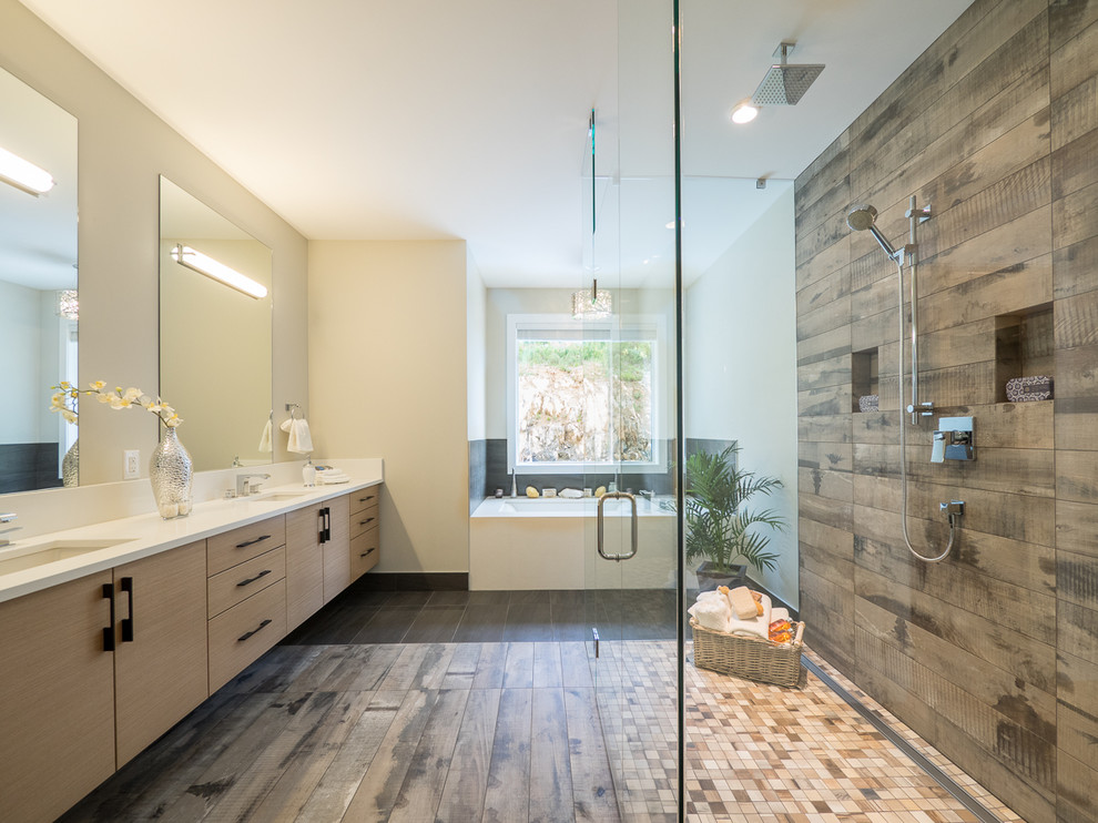 Inspiration for a contemporary master bathroom in Vancouver with flat-panel cabinets, beige cabinets, an undermount tub, a curbless shower, porcelain tile, porcelain floors, an undermount sink, solid surface benchtops and a hinged shower door.