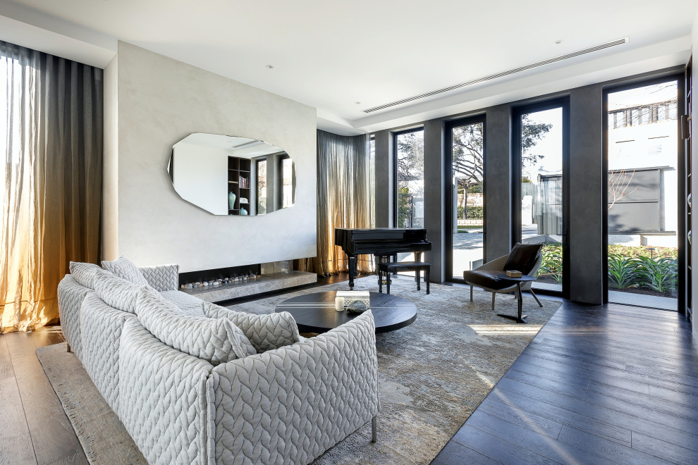Inspiration for an expansive contemporary formal living room in Melbourne with a stone fireplace surround, white walls, dark hardwood floors, a ribbon fireplace, no tv and black floor.