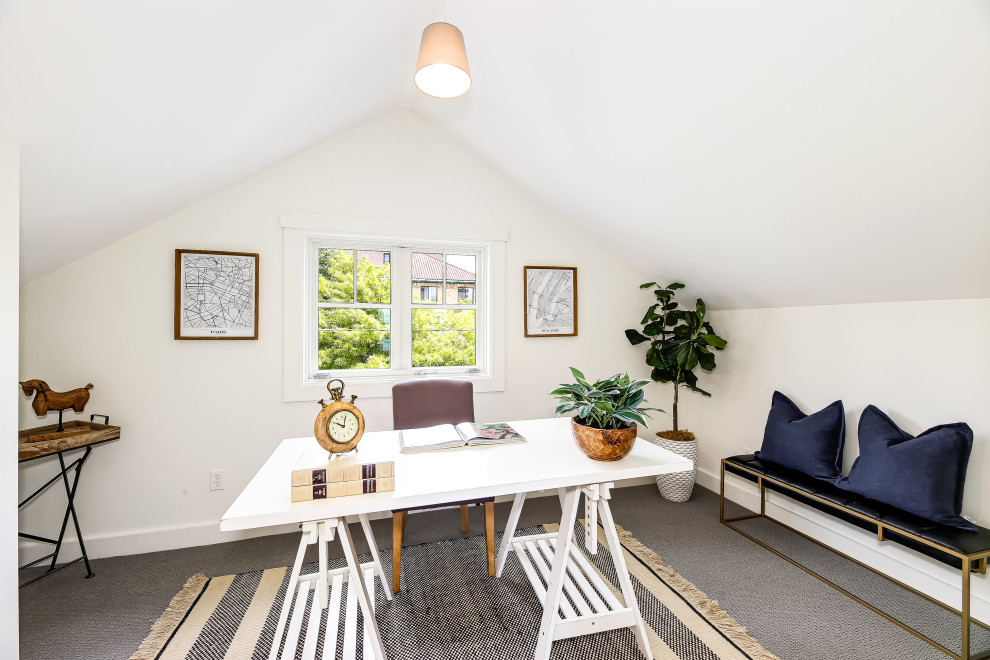 Small transitional home office in Seattle with white walls, carpet, grey floor and vaulted.