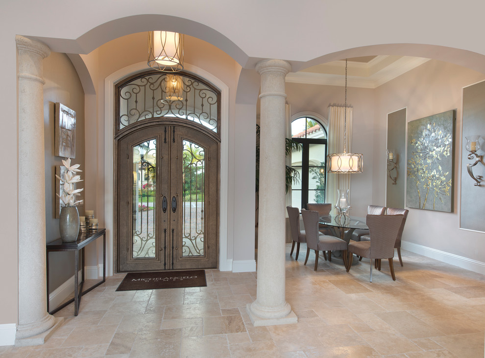 Design ideas for a large mediterranean foyer in Miami with beige walls, travertine floors, a double front door and a metal front door.