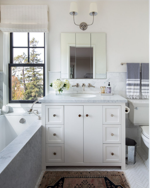 White Marble Tiled Niches Filled with Candles Over Tub - Transitional -  Bathroom