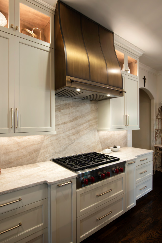 Example of a large transitional l-shaped dark wood floor and brown floor open concept kitchen design in Nashville with an undermount sink, beaded inset cabinets, white cabinets, quartzite countertops, beige backsplash, stone slab backsplash, stainless steel appliances, an island and beige countertops