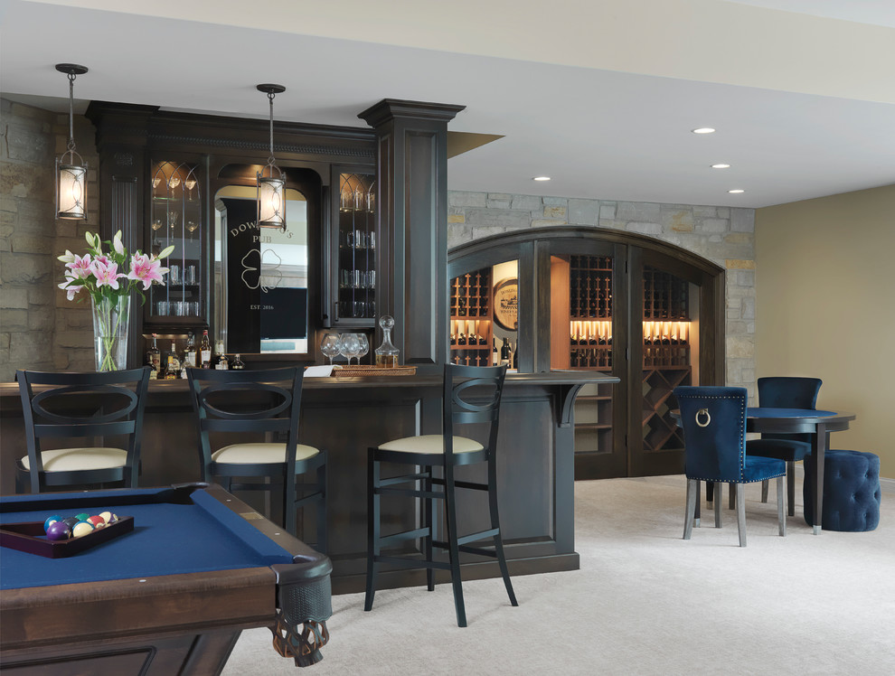 Inspiration for a traditional galley seated home bar in St Louis with raised-panel cabinets, dark wood cabinets, wood benchtops, grey splashback, carpet, white floor and brown benchtop.