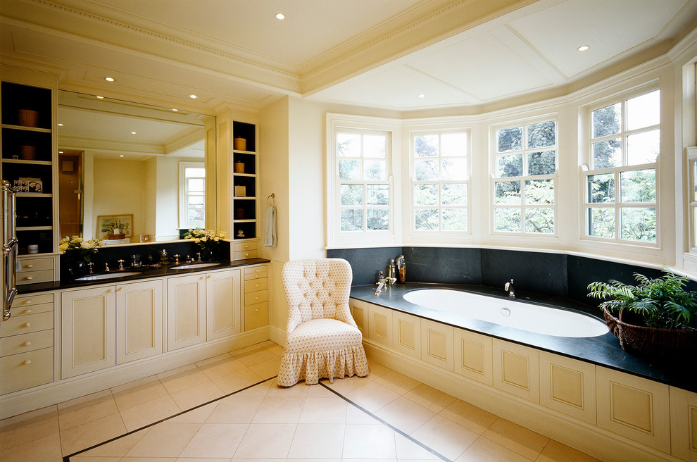 This is an example of a traditional bathroom in London with an undermount tub.