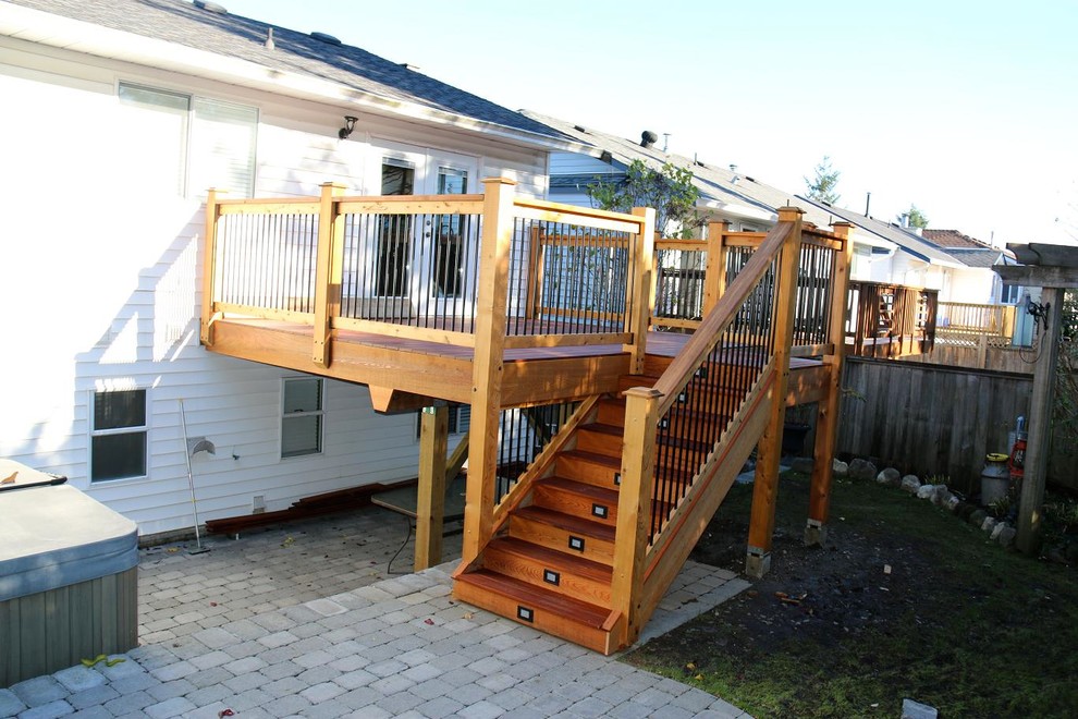 Photo of a small contemporary backyard deck in Vancouver with no cover.