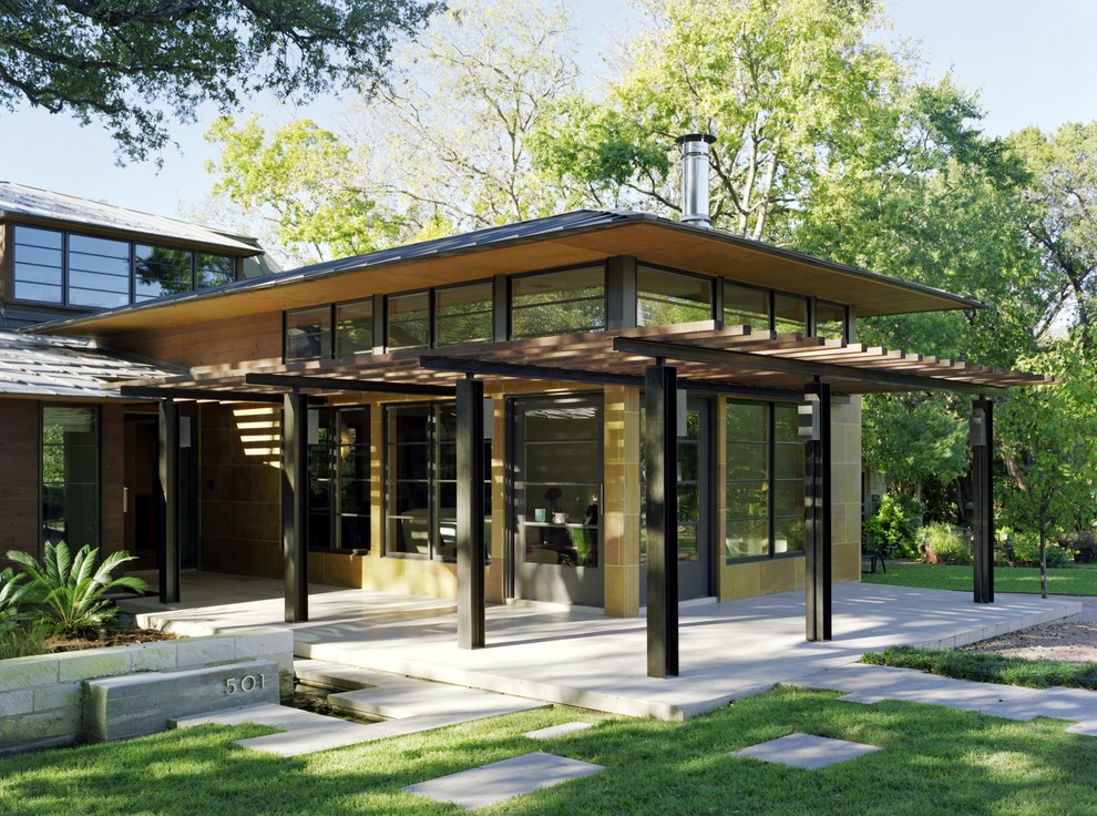 Inspiration for an asian exterior in Austin with a hip roof.