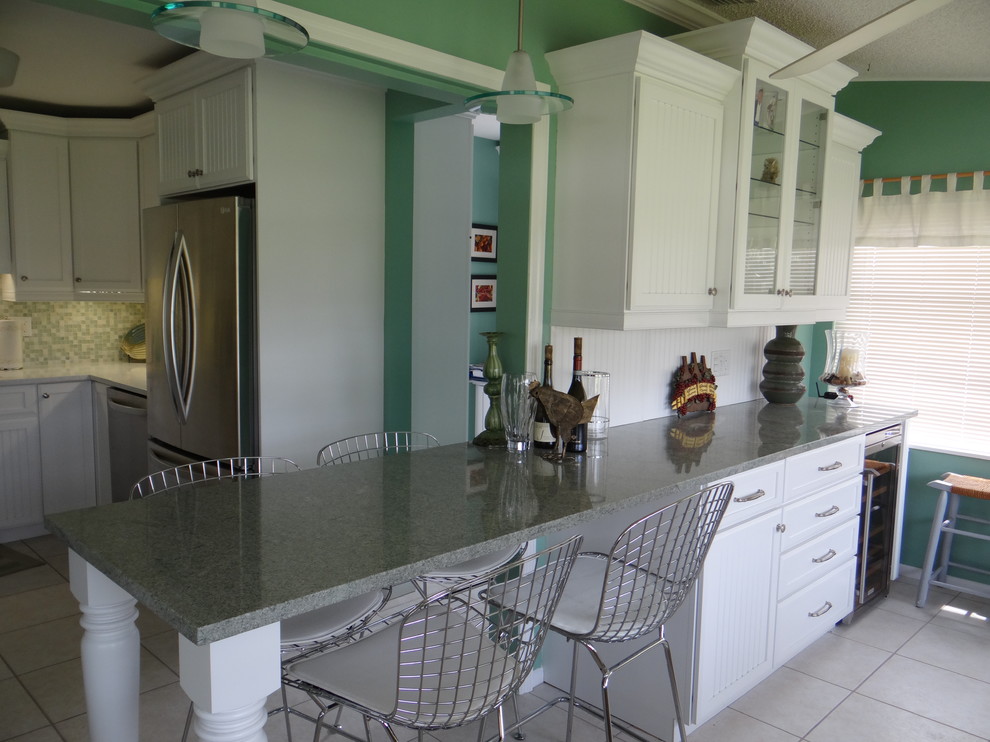 This is an example of a mid-sized beach style kitchen in Tampa.