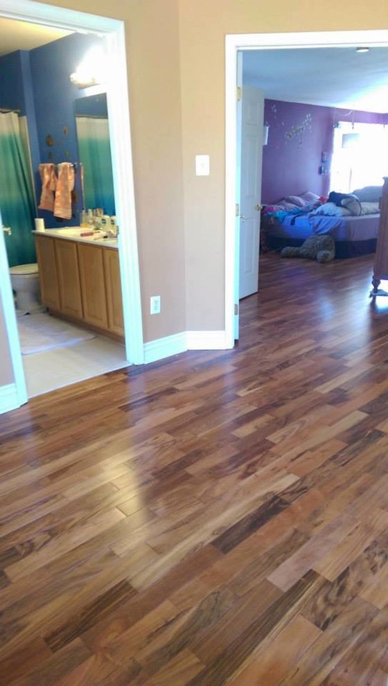 Example of a mid-sized transitional medium tone wood floor hallway design in Baltimore with beige walls