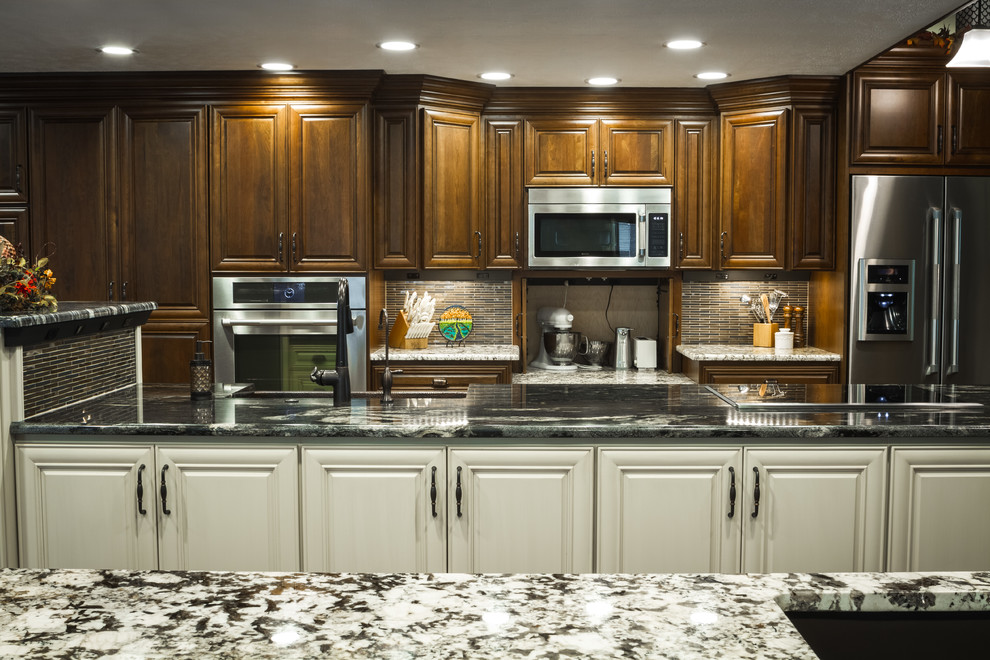 Example of a large transitional l-shaped eat-in kitchen design with a farmhouse sink and two islands