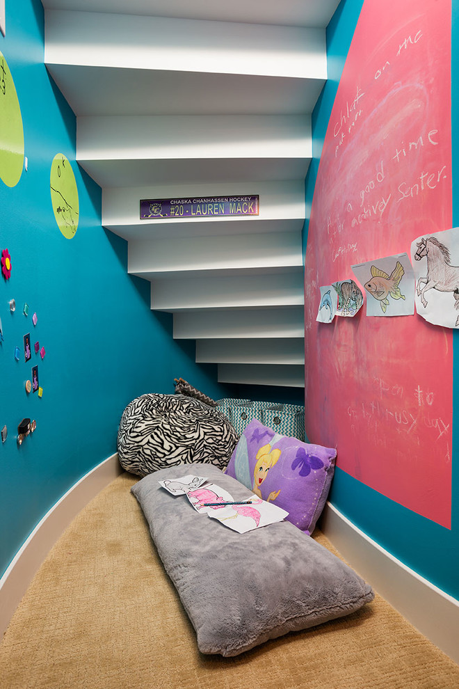 Photo of a small contemporary kids' playroom for girls and kids 4-10 years old in Minneapolis with multi-coloured walls and carpet.