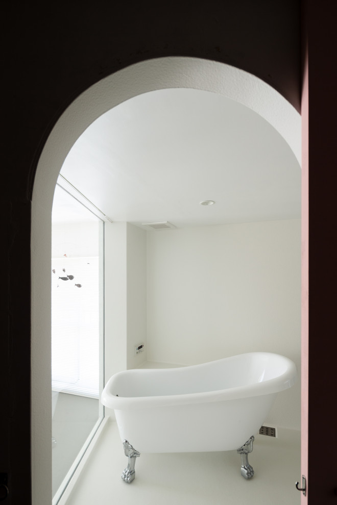 Design ideas for a mid-sized contemporary wet room bathroom in Tokyo with white cabinets, a claw-foot tub, a two-piece toilet, white tile, white walls, white floor, a hinged shower door, a single vanity, a freestanding vanity, timber and planked wall panelling.