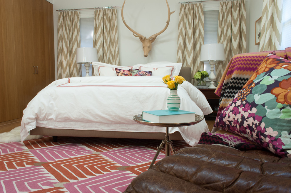 This is an example of an eclectic bedroom in Dallas.