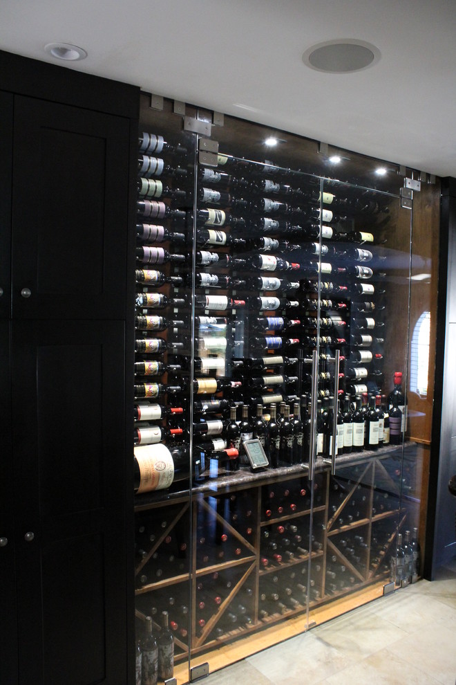 Inspiration for a small contemporary wine cellar in Denver with display racks and marble floors.