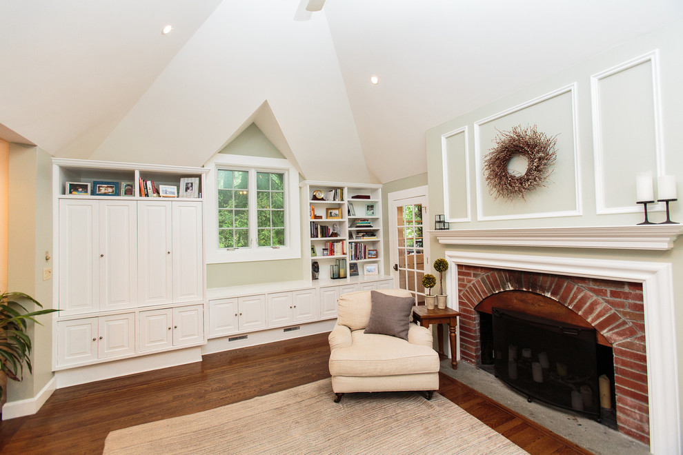 This is an example of a midcentury formal open concept living room in Boston with white walls, carpet, a standard fireplace and a brick fireplace surround.