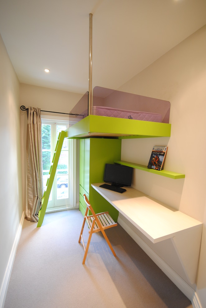 This is an example of a small contemporary gender-neutral kids' room in London with white walls.